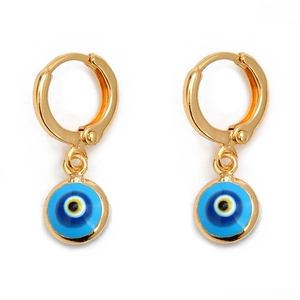 Macro view of gold hoop earrings with multi-colored blue Evil Eye pendant charms