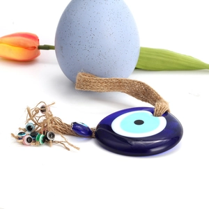 Blue glass evil eye wall hanging with colorful beads and natural jute rope decor