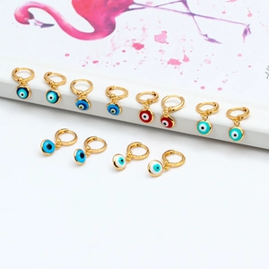 Detail shot of golden evil eye hoop earrings in various vibrant enamel color options