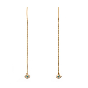 Detail of long gold drop earrings featuring a blue evil eye pendant with crystals