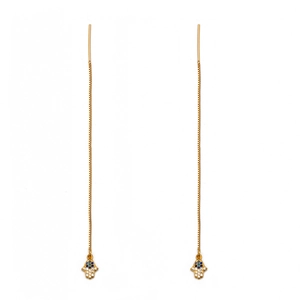 Close-up of golden long ear threaders with Hamsa hand and blue evil eye detail