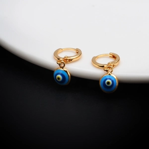 Detailed view of gold evil eye hoop earrings featuring vibrant blue enamel pendants