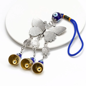 Blue evil eye butterfly wall hanging with alloy metal bells and lucky nazar beads
