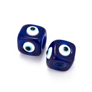 Macro detail of blue cube evil eye spacer beads for DIY jewelry making and crafts