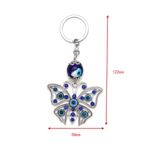 Blue evil eye butterfly keychain with silver metal and sparkling crystal accents