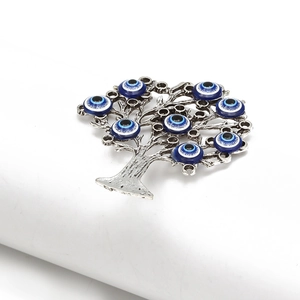 Detailed 45-degree angle view of silver alloy tree of life with nine evil eye beads