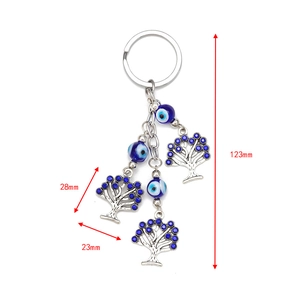 Detail of evil eye keychain with tree of life pendants showing dimensions 123mm and 28mm