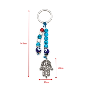 Detailed view of Hamsa Hand and Evil Eye keychain showing size specs 145mm by 40mm