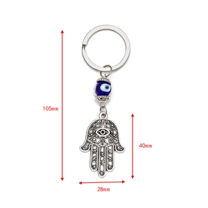 Hamsa Hand and Evil Eye keychain with Tree of Life engraving and blue glass beads
