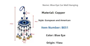 Detailed view of evil eye wall hanging with Hamsa hand design and five golden bells