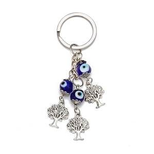 Blue Evil Eye keychain with Tree of Life charms and decorative glass beads on metal ring