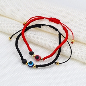 Adjustable red and black braided lava stone bracelets with evil eye glass beads