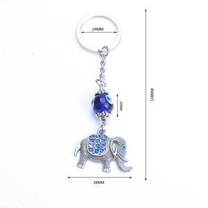 Blue evil eye elephant keychain with blue rhinestones and dimensions displayed