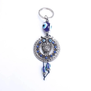 Vintage silver owl keychain with blue evil eye beads and sparkling blue rhinestones