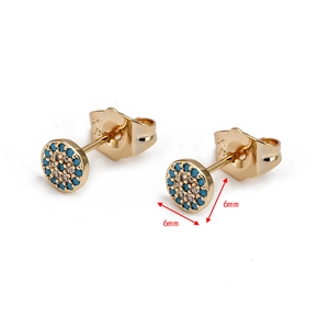 Macro view of 6mm golden stud earrings featuring sky blue stones and tiny white zircons
