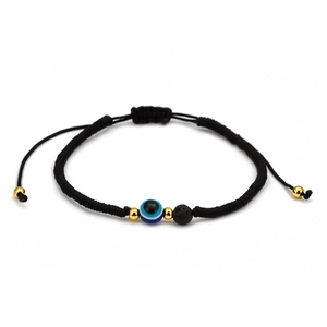 Macro view of woven red rope bracelet with blue evil eye bead and black volcanic stones