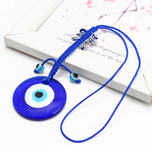 Pendentif œil grec bleu en verre avec corde tressée à la main et petites perles déco