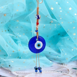Detailed view of Turkish Evil Eye pendant with hand-woven knots and blue glass beads