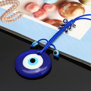 Pendentif œil grec en verre avec cordon tressé bleu royal et ornements ethniques faits main