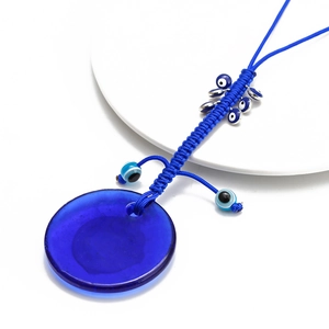 Pendentif œil grec en verre bleu foncé avec cordon tressé à la main et perles