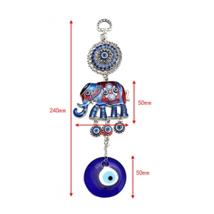 Detail view of Evil Eye elephant wall hanging with dimensions for home decor