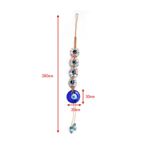 Detail view of the 30mm blue glass evil eye pendant with dimensions and braided cord
