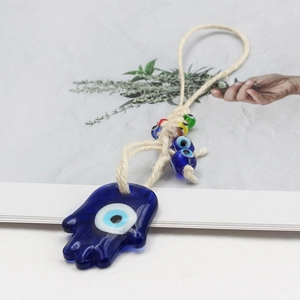 Detailed Hamsa Hand glass ornament with blue Evil Eye charm and colorful beads decoration
