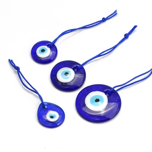 Blue glass evil eye Nazar pendants in four varying sizes with blue nylon cords