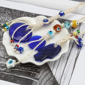 Blue glass evil eye Nazar amulet and Hamsa hand wall hanging home decor accessories