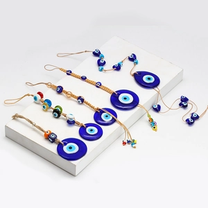 Macro detail of Turkish evil eye glass charms featuring blue concentric circle patterns