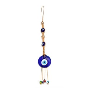 Close-up of glass evil eye pendant with handcrafted woven ropes and colorful beads