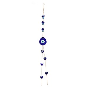Detail of Turkish blue glass Evil Eye wall hanging with heart-shaped beads and twine