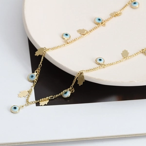 Collana a catena dorata con perline blu Malocchio e ciondoli della Mano di Fatima