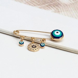 Broche Œil du Diable dorée avec émail bleu et breloque soleil pour vêtements femme