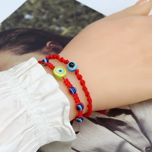 Handmade red braided Evil Eye bracelets with adjustable cords for protection and style