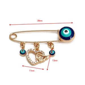 Détail de la broche œil protecteur avec cœur en cristal et dimensions de taille 38mm