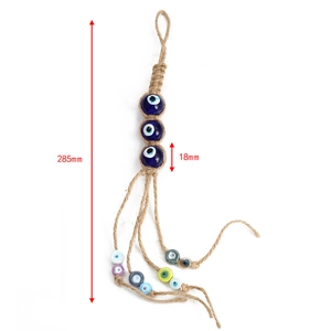 Detail view of woven evil eye pendant with 285mm length and 18mm glass beads