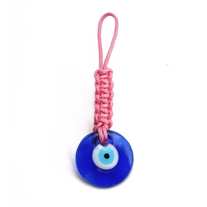 Detailed view of handmade pink braided rope with Turkish Blue Evil Eye glass pendant