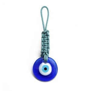 Detail of woven light blue cord and polished glass evil eye charm on a keychain