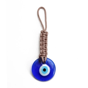 Detailed close-up of handmade woven rope Evil Eye keychain with blue glass nazar pendant