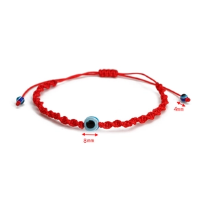 Detail of red braided Evil Eye bracelet with 8mm and 4mm beads and adjustable cord