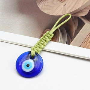 Handmade woven Evil Eye keychain with blue glass pendant and green braided nylon rope strap