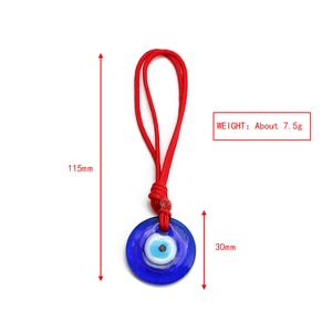 Blue glass Evil Eye charm with red braided cord showing dimensions 115mm and 30mm