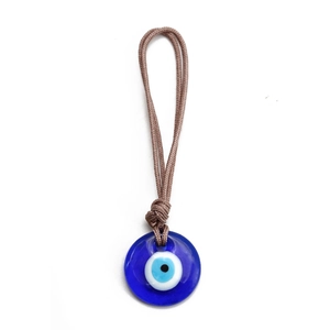 Detailed view of handmade dark blue glass Evil Eye pendant with brown braided cord