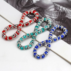Detail of colorful Evil Eye beaded bracelets with sparkling rhinestone spacers