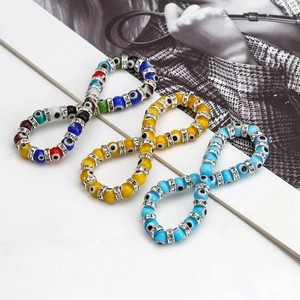 Detailed view of Evil Eye beaded bracelets with crystals and Mediterranean patterns