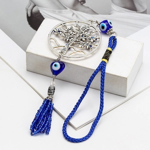 Porte-clés Arbre de Vie avec perles œil bleu et pompon long sur socle en pierre