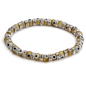Minimalist evil eye beaded bracelet with amber resin charms and sparkling silver accents