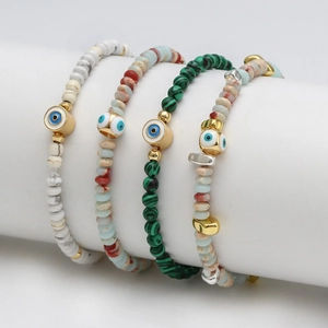 Set of Evil Eye beaded bracelets with colorful natural stones and gold metal accents