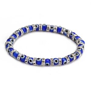 Detailed macro view of dark blue evil eye beads with sparkling crystal silver spacers